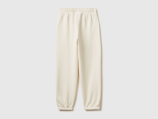 Фото ракурс 2 - Бежеві штани для дівчаток Benetton артикул 39M2CF05I.G 0R2 25I