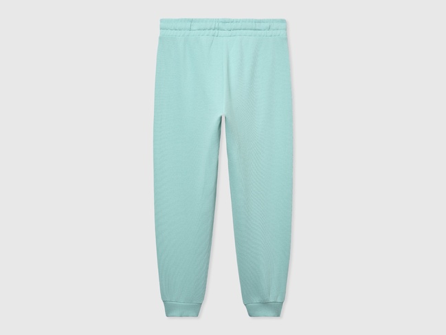 Фото ракурс 2 - Голубые штаны для девочек Benetton артикул 3J68CF02H.G 3Y1 25P