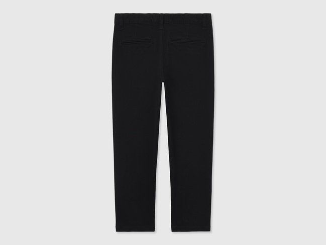 Фото ракурс 2 - Чорні штани для хлопчиків Benetton артикул 4HM6CF04X.G 100 25A
