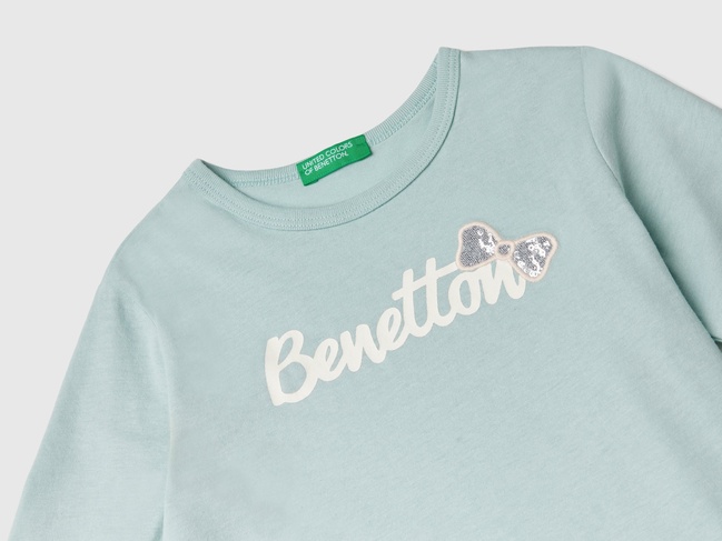 Фото ракурс 3 - Бирюзовый лонгслив для девочек Benetton  артикул 3ATNG10GI.P 17H 24I