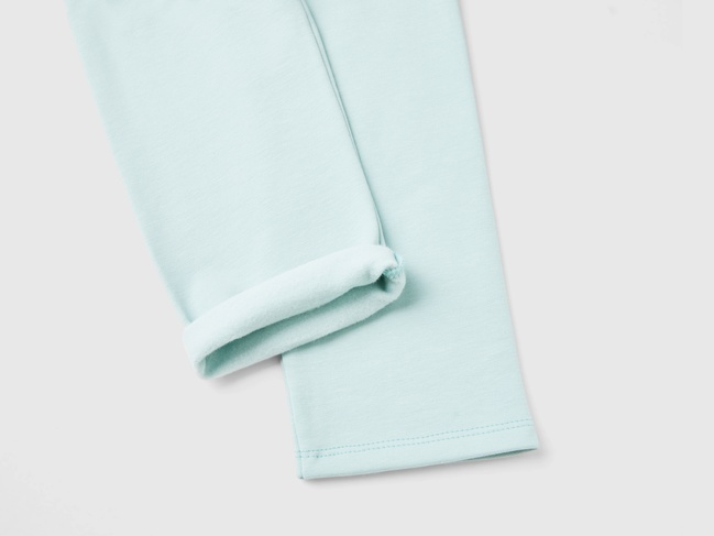 Фото ракурс 3 - Бірюзові лосини для дівчаток Benetton артикул 35Q2GF019.P 17H 24I