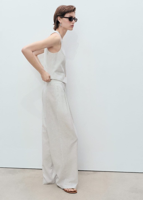 Женский молочный жилет Mango артикул 87087704 05 8 season Фото ракурс 4 - Женский молочный жилет Mango артикул 87087704 05 8 season