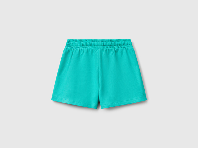 Бірюзові шорти для дівчаток Benetton артикул 3BL0G901T.P 25J 25E Фото ракурс 2 - Бірюзові шорти для дівчаток Benetton артикул 3BL0G901T.P 25J 25E